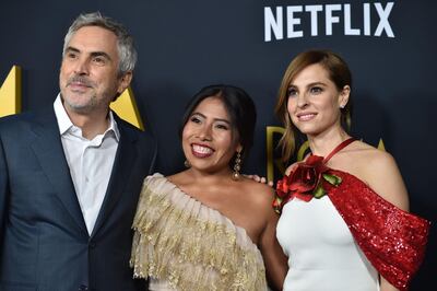 (FILES) In this file photo taken on December 10, 2018 (FILES) In this file photo taken on December 10, 2018, Mexican director Alfonso Cuarón (L), Mexican actress Yalitza Aparicio (C) and Mexican actress Marina de Tavira (R) arrive for the Los Angeles premiere of "Roma" at the Egyptian theatre in Hollywood, California.  From a superhero blockbuster to an offbeat royal comedy of manners to an intimate black-and-white ode to 1970s Mexico City, the contenders for this year's best picture Oscar are as varied as ever. Here is a brief summary of the eight films vying for the most prestigious prize at Sunday's Oscars ceremony: Alfonso Cuaron's love letter to his childhood -- and the two women who guided him, his mother and his nanny -- has been the overwhelming favorite to win the top prize on Sunday. If it does win, it will be the first foreign-language film to do so, and the first best picture winner for streaming giant Netflix.

 / AFP / Robyn Beck / With AFP Story by Javier TOVAR:   With 'Roma,' Alfonso Cuaron reinvents how he makes films
