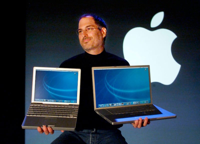 Apple Computer CEO Steve Jobs holds a new 12 inch Apple G4 Powerbook laptop computer in his right hand and a new 17 inch Apple G4 Powerbook in his left after his keynote address at the Macworld Conference and Expo in San Francisco in this January 7, 2003 file photo. Apple Inc co-founder and former CEO Jobs, counted among the greatest American CEOs of his generation, died on October 5, 2011 at the age of 56, after a years-long and highly public battle with cancer and other health issues.  REUTERS/Lou Dematteis/Files  (UNITED STATES - Tags: SCIENCE TECHNOLOGY OBITUARY BUSINESS) *** Local Caption ***  SAF01D_APPLE-JOBS_1006_11.JPG