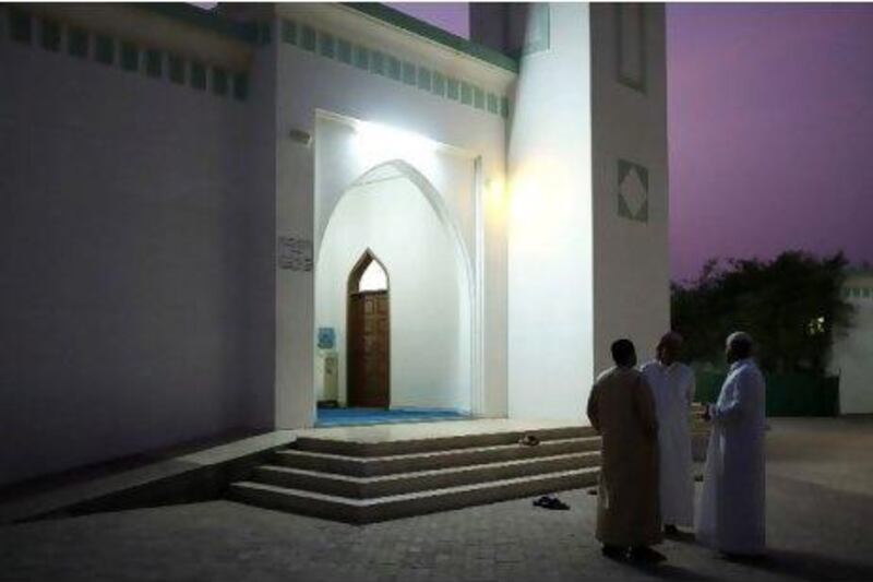 Residents of Mohadhub village near Falaj Al Moalla in Umm Al Quwain gather outside the Aqeel Ibn Abi Talib mosque.