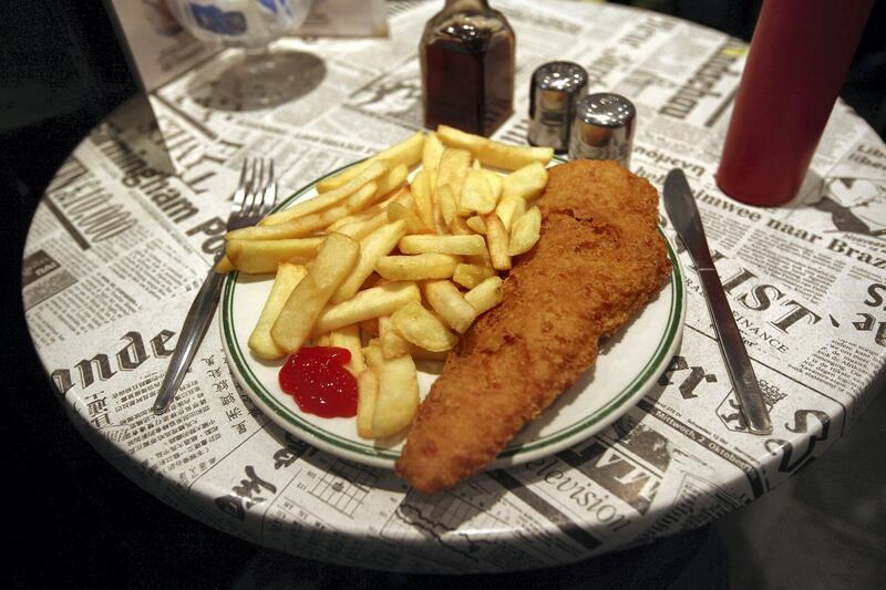 LONDON, ENGLAND - FEBRUARY 22:  A traditional dish of Fish and Chips is placed on a table in a cafe on February 22, 2011 in London, England.  (Photo by Peter Macdiarmid/Getty Images)