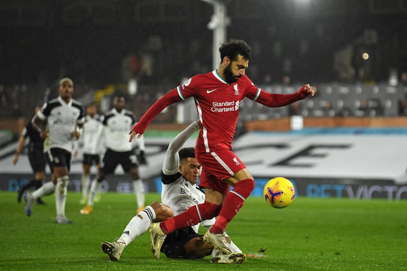 Fulham's defender Antonee Robinson vies with Liverpool's midfielder Mohamed Sala. AFP