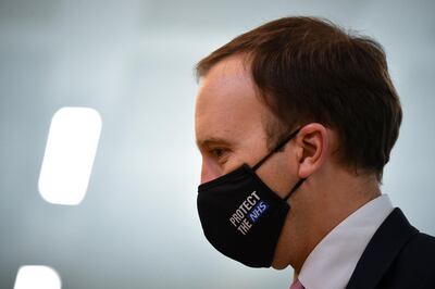 LONDON, ENGLAND - OCTOBER 27: Britain's Health Secretary Matt Hancock wearing a face mask during a visit with Britain's Camilla, Duchess of Cornwall (unseen) to watch a demonstration by the charity Medical Detection Dogs, which trains dogs to detect the odour of human disease at Paddington Station on October 27, 2020 in London, England. (Photo by Justin Tallis - WPA Pool/Getty Images)