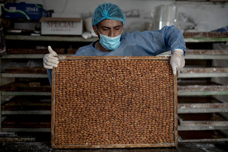 Workers bake the sweets. 