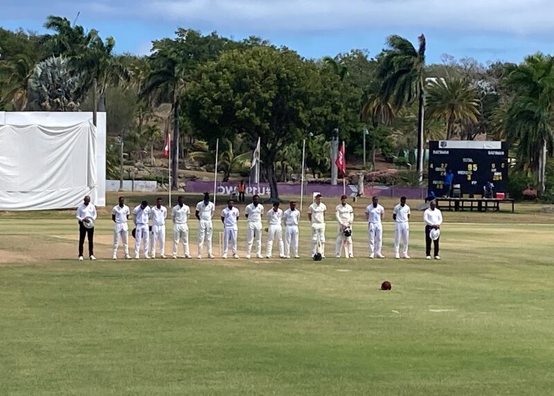 England batsmen Dan Lawrence and Ben Foakes during a minute's silence for Shane Warne ahead of their match against Cricket West Indies President’s XI at Coolidge Cricket Ground, Antigua. PA