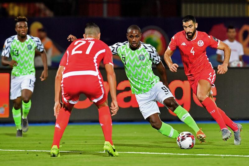 Ighalo makes a run at the Tunisia defence. AFP