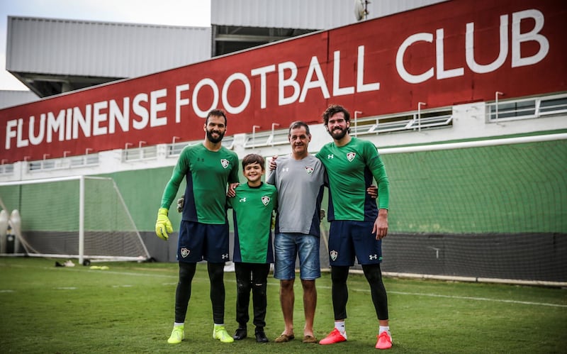 epa09036021 A handout photo made available by the Fluminense FC that shows businessman Jose Becker (2-R), father of Brazilian goalkeepers Alisson (R), from Liverpool FC, and Muriel (L), from Fluminense, while posing in Rio de Janeiro, Brazil, 25 February 2021. Becker drowned in a dam that passes through his property in the south of the country, as reported early 25 February by relief agencies.  EPA/Lucas MerÃ§on / Fluminense FC HANDOUT (MANDATORY CREDIT) HANDOUT EDITORIAL USE ONLY/NO SALES