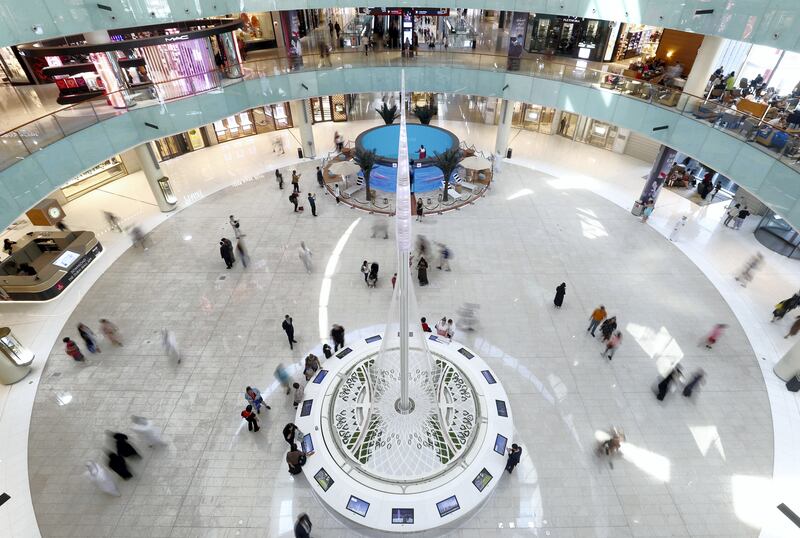 Dubai, United Arab Emirates - September 21, 2019: Standalone. A busy afternoon at Dubai mall as people shop at the weekend in front of the Dubai Creek Tower model. Saturday the 21st of September 2019. Dubai Mall, Dubai. Chris Whiteoak / The National