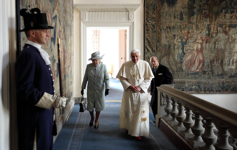 Queen Elizabeth and Prince Philip walk with Pope Benedict XVI to the Morning Drawing Room in the Palace of Holyroodhouse, the Queen's official residence in Scotland, in September 2010. Getty Images