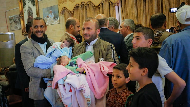 Mohammad and Ahmed surrounded by family in Sanaa. Unicef