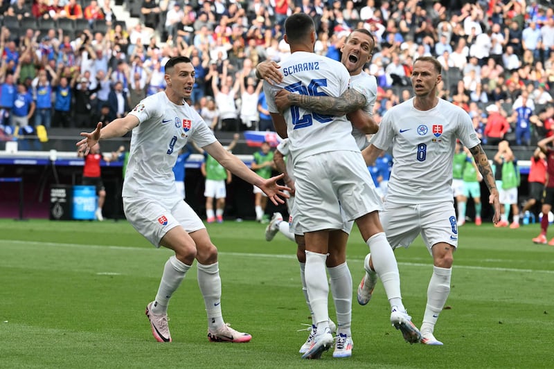 Slovakia's Ivan Schranz celebrates with teammates after scoring the only goal of the game against Slovakia in the Euro 2024 Group E clash at the Frankfurt Arena  on June 17, 2024. AFP