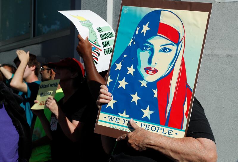 epa06843120 People with the Council on American-Islamic Relations (CAIR) and supporters demonstrate against a ruling by the United States Supreme Court upholding US President Donald J. Trump's travel ban on people from mostly Muslim countries in San Jose, California, USA, 26 June 2018.  EPA/JOHN G. MABANGLO