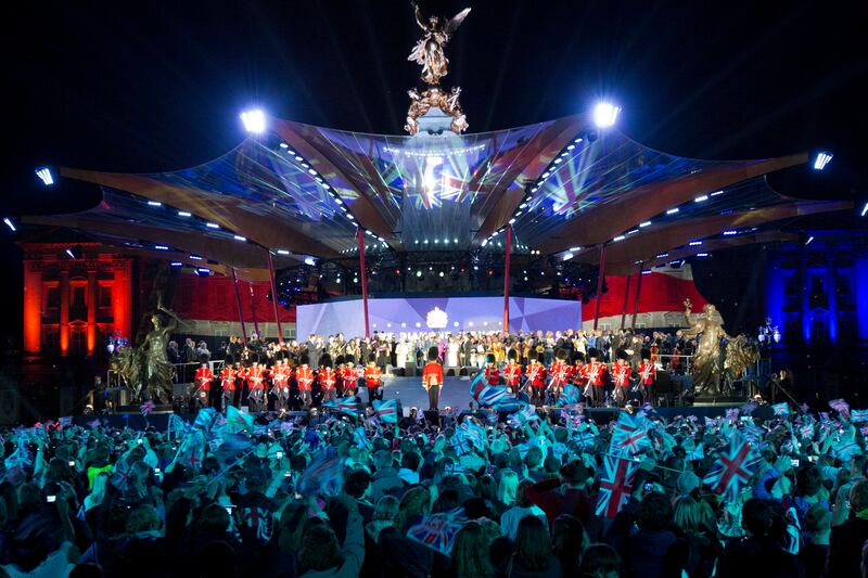 Queen Elizabeth is joined on stage by Prince Charles and performers during the diamond jubilee celebrations at a Buckingham Palace concert in June 2012.