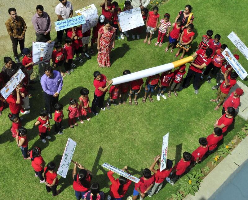 Indian schoolchildren in Patiala on Friday make a human “No Smoking” sign during an awareness programme on the eve of World No Tobacco Day.  The World Health Organisation and partners use the day to highlight the health risks associated with tobacco use.  Kamal Sachar / AFP