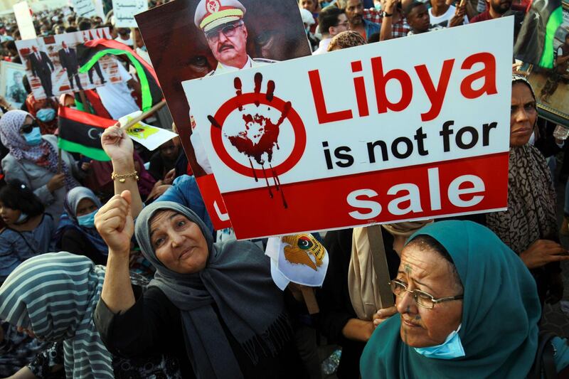 Supporters of Libyan military strongman Khalifa Haftar take part in a gathering in the eastern Libyan port city of Benghazi, to protest against Turkish intervention in the country's affairs. AFP
