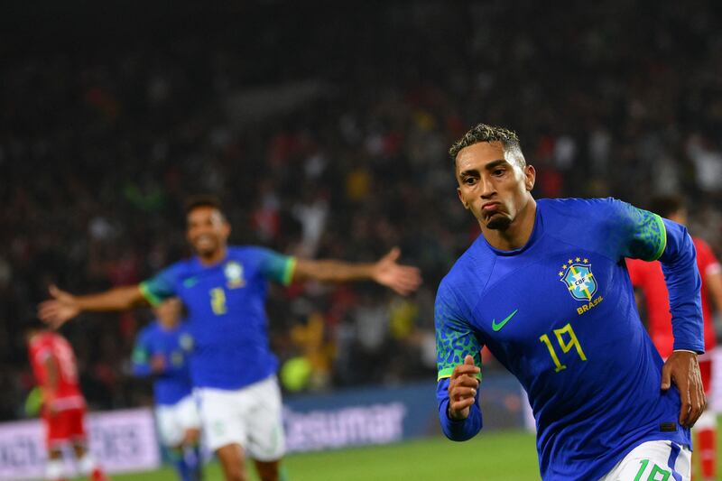 Brazil forward Raphinha celebrates scoring his team's fourth goal against Tunisia. AFP