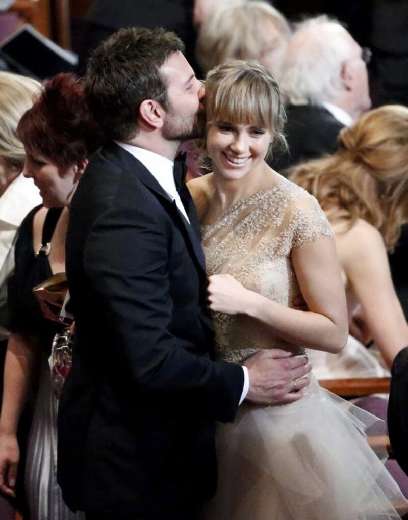 Bradley Cooper, best supporting actor nominee for his role in American Hustle, and his girlfriend Suki Waterhouse. 