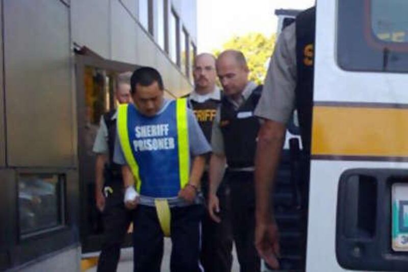 Vince Weiguang Li, 40, is led into the Manitoba Provincial Court in Portage La Prairie.