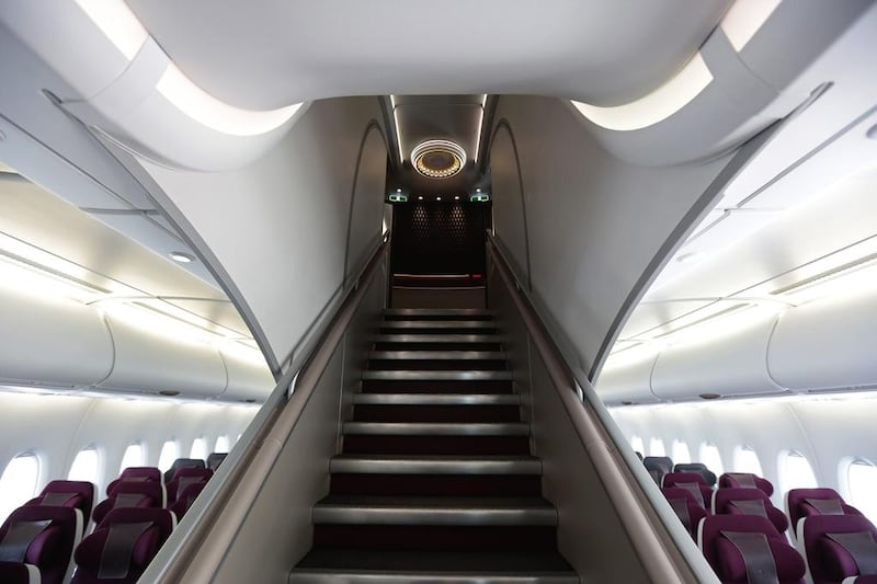 An access stairway leads to the first class cabins on the upper level of an Airbus A380 aircraft, operated by Qatar Airway. Jason Alden / Bloomberg