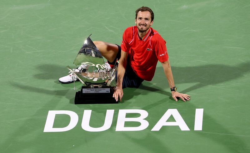 Daniil Medvedev poses with trophy after beating Andrey Rublev to win the Dubai Duty Free Tennis Championships title on March 4, 2023. Reuters
