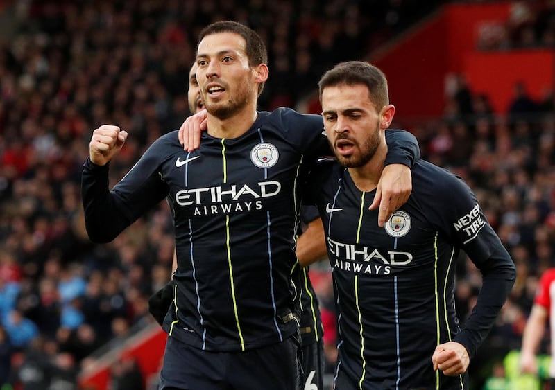 Soccer Football - Premier League - Southampton v Manchester City - St Mary's Stadium, Southampton, Britain - December 30, 2018  Manchester City's David Silva celebrates with Bernardo Silva after scoring their first goal   Action Images via Reuters/John Sibley  EDITORIAL USE ONLY. No use with unauthorized audio, video, data, fixture lists, club/league logos or "live" services. Online in-match use limited to 75 images, no video emulation. No use in betting, games or single club/league/player publications.  Please contact your account representative for further details.