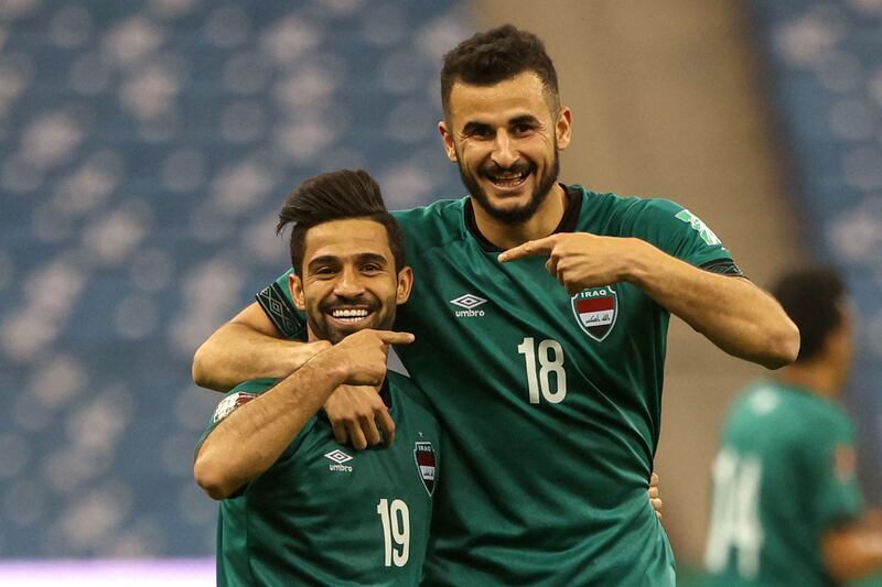 Iraq's forward Hussein al-Saedi (L) celebrates his opening goal with Iraq's midfielder Aymen Hussein during the 2022 Qatar World Cup Asian Qualifiers football match between Iraq and United Arab Emirates, at the King Fahd International stadium in the Saudi capital Riyadh, on March 24, 2022.  (Photo by FAYEZ NURELDINE  /  AFP)