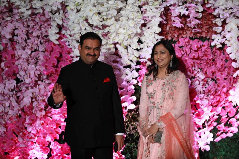 Gautam Adani (L), Indian billionaire industrialist, chairman and founder of the Adani Group, with his wife. Photo: EPA