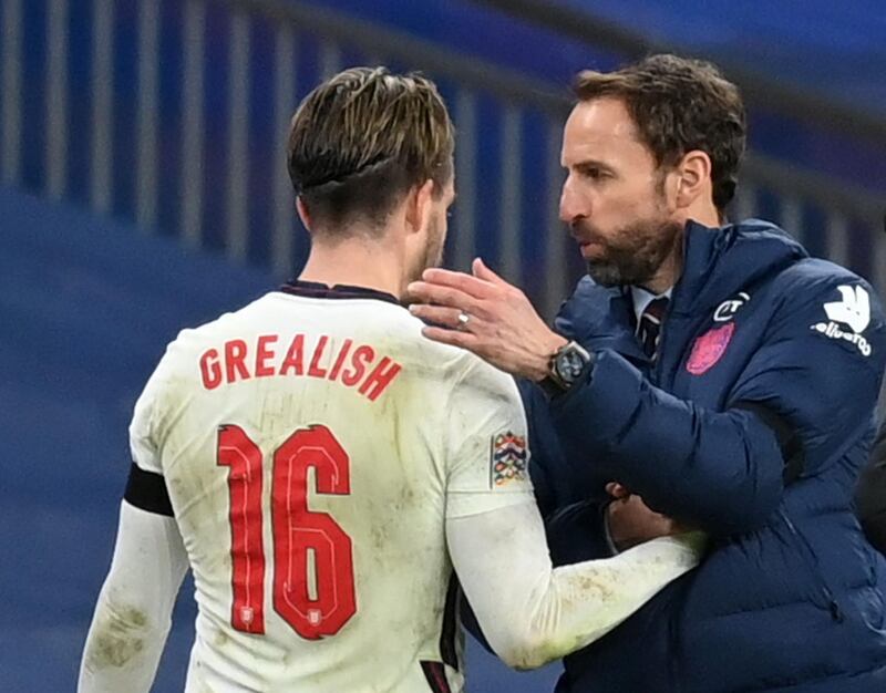 Jack Grealish shakes hands with England manager Gareth Southgate. Reuters
