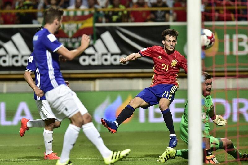 Spain midfielder David Silva shoots to score Spain’s third goal. Alvaro Barrientos / AP Photo