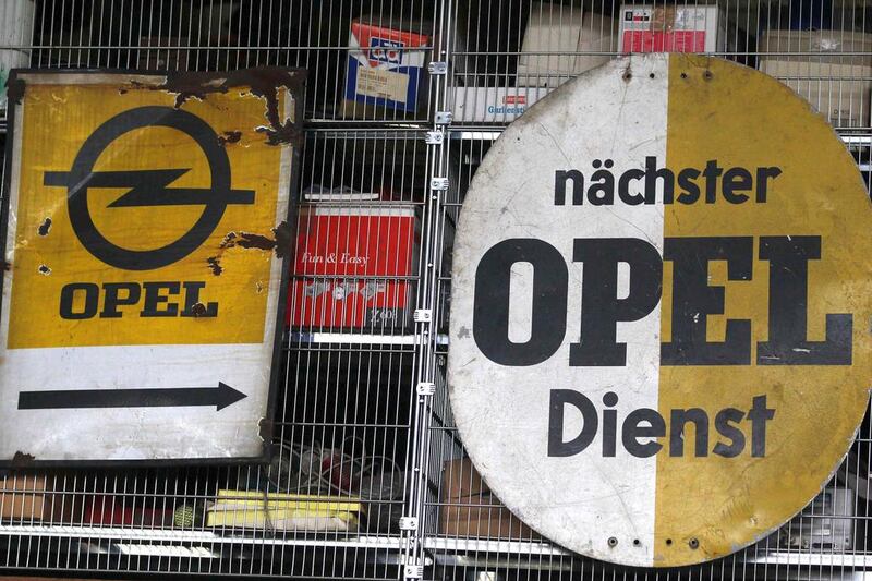 Vintage Opel signs are seen at the Opel museum in Herne. Ina Fassbender / Reuters