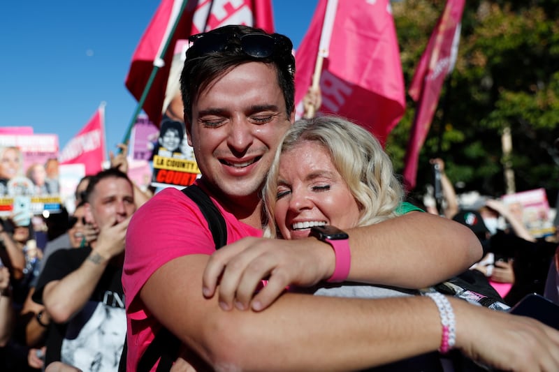 Filipe Servat and Lindsey Fairchild embrace upon hearing the news that Britney Spears's conservatorship has been terminated. EPA