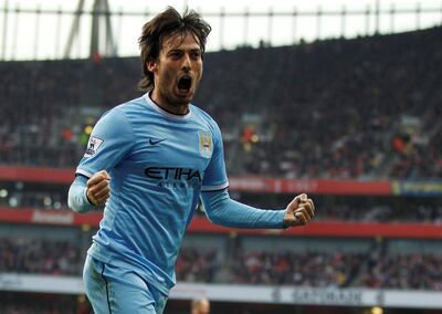 Manchester City's Spanish midfielder David Silva celebrates scoring a goal during the English Premier League football match between Arsenal and Manchester City at the Emirates Stadium in London on March 29, 2014. AFP PHOTO / IAN KINGTON
                                                                                                             
RESTRICTED TO EDITORIAL USE. No use with unauthorized audio, video, data, fixture lists, club/league logos or "live" services. Online in-match use limited to 45 images, no video emulation. No use in betting, games or single club/league/player publications. (Photo by IAN KINGTON / AFP)