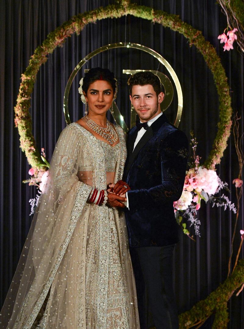 Newlyweds Priyanka Chopra and Nick Jonas pose for a photograph during a reception at a hotel in New Delhi on December 4, 2018. Photo: AFP