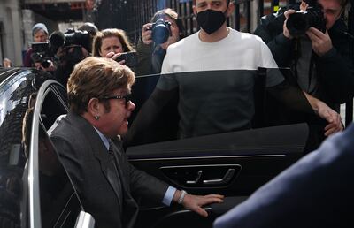 Elton John arrives at the High Court in London.  EPA 