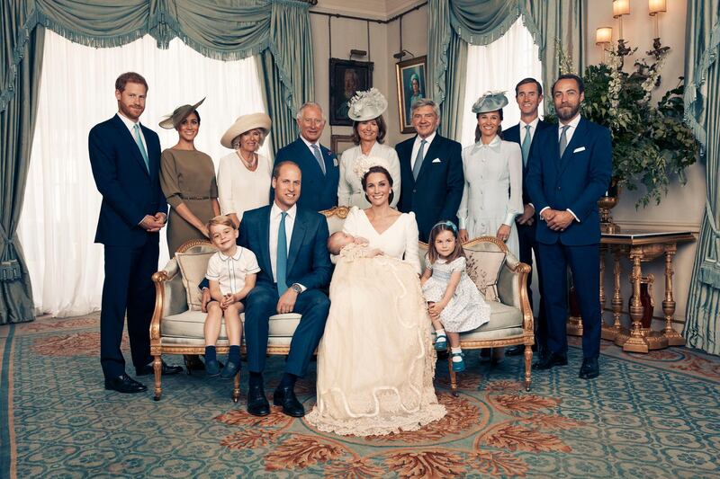 A family portrait to mark the christening of Prince Louis at Clarence House. Seated, left to right: Prince George, Prince William, Prince Louis, the Duchess of Cambridge and Princess Charlotte. Standing, left to right: Prince Harry, Megan, the Duchess of Sussex; Camilla, the Duchess of Cornwall; Prince Charles, Prince of Wales; Carole Middleton, Michael Middleton, Pippa Matthews, James Matthews and James Middleton. AP