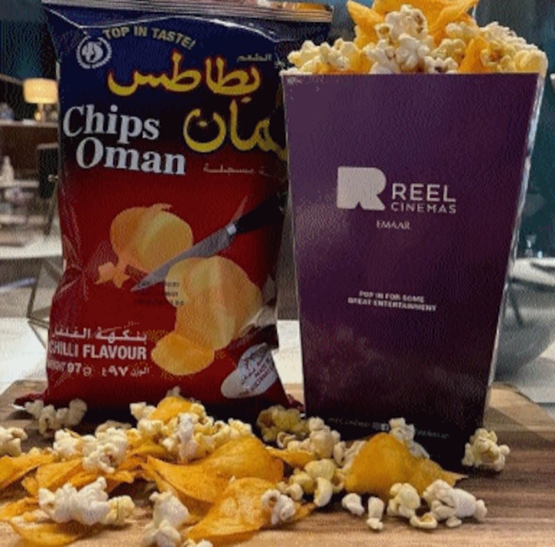 Chips Oman and popcorn make for an addictive snacking combination at Reel Cinemas. Courtesy Reel Cinemas
