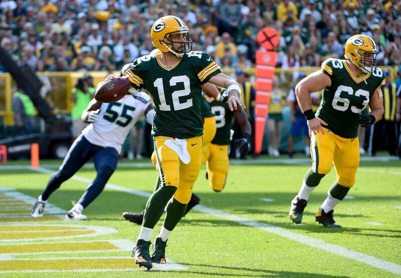 Sep 10, 2017; Green Bay, WI, USA;  Green Bay Packers quarterback Aaron Rodgers (12) looks to pass in the second quarter during the game against the Seattle Seahawks  at Lambeau Field. Mandatory Credit: Benny Sieu-USA TODAY Sports