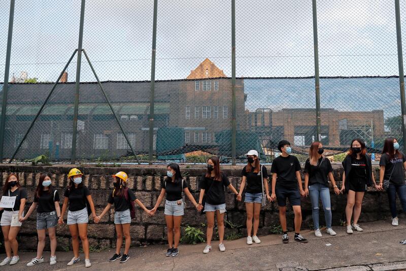 People form human chain outside the Maryknoll Convent School in Hong Kong on Friday, Sepember. 6, 2019. AP Photo