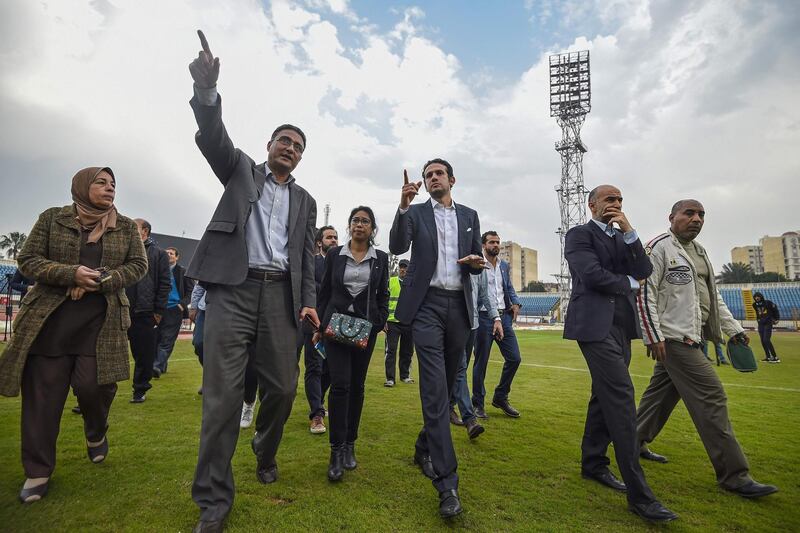 Executive Director of the 2019 Africa Cup of Nations Mohamed Fadl (3rd-R) and a  delegation of the African Football Confederation inspect the Stadium of Alexandria as one of the tournament venues in Alexandria, on February 05, 2019.  / AFP / Mohamed el-Shahed
