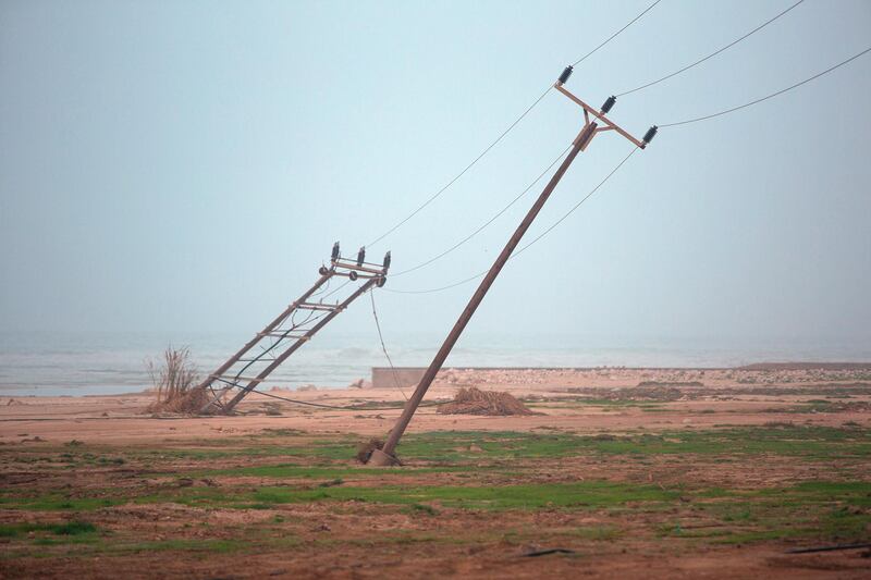 Two power poles, looking towards the ocean from Mughsail Beach. Antony Hansen for The National