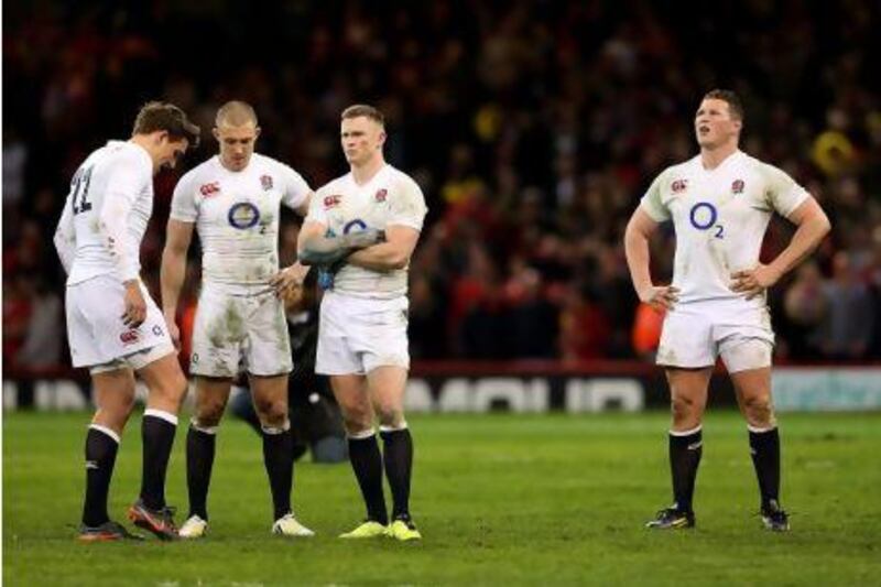 Left to right, dejected England players Toby Flood, Mike Brown, Chris Ashton and Dylan Hartley after defeat to Wales.