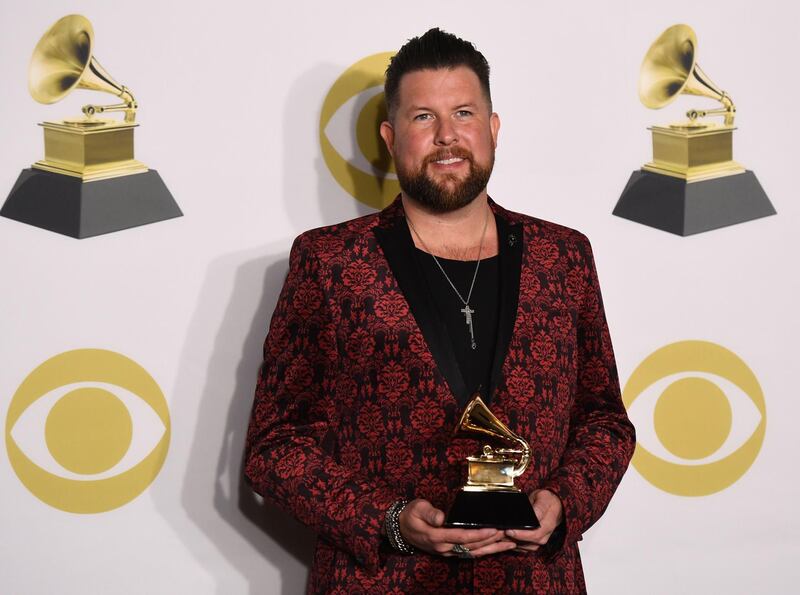 Zach Williams, winner of Best Contemporary Christian Music Album for 'Chain Breaker' poses in the press room. AFP
