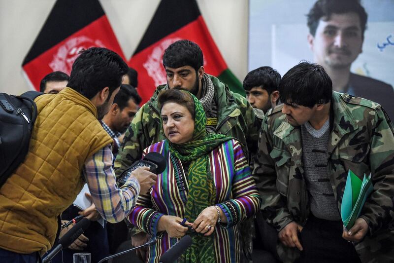 Head of the Afghan Independent Election Commission Hawa Alam Nuristani, centre, speaks to media representatives after announcing the final election results in a press conference in Kabul on February 18, 2020.  AFP