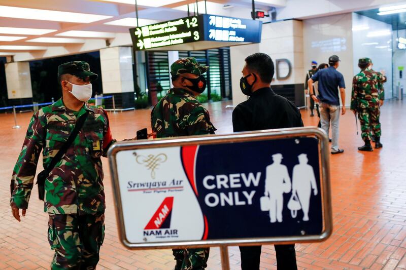 Indonesian soldiers are seen at Soekarno-Hatta International Airport after Sriwijaya Air plane flight SJ182 with more than 50 people on board lost contact after taking off, according to local media, in Tangerang, near Jakarta, Indonesia. Reuters