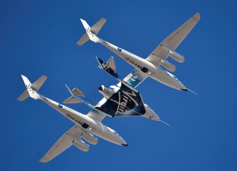 Virgin Galactic rocket plane, the WhiteKnightTwo carrier aircraft, with SpaceShipTwo passenger craft takes off from Mojave Air and Space Port in the US.  Reuters