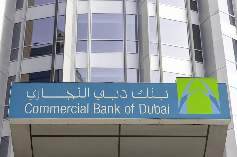 A logo sits on display outside a Commercial Bank of Dubai PSC main bank branch in Dubai, United Arab Emirates, on Tuesday, Sept. 4, 2018. Abu Dhabi is engineering a second bank merger in its latest attempt to stay competitive in the era of lower oil prices. Photographer: Christopher Pike/Bloomberg