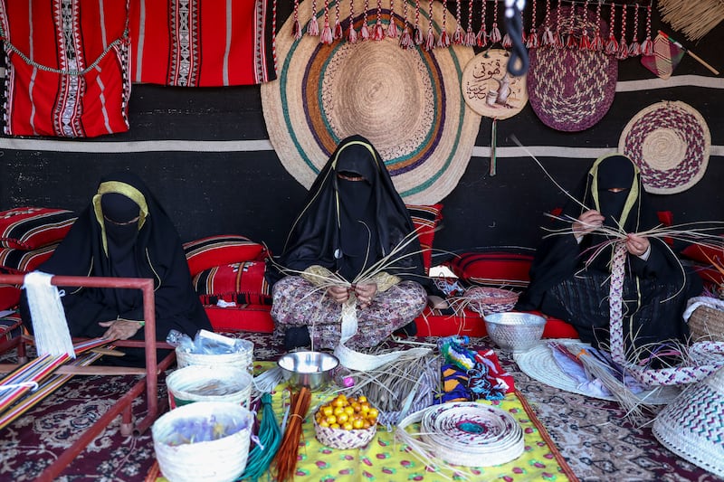 Local Bedouin women making traditional handicrafts.