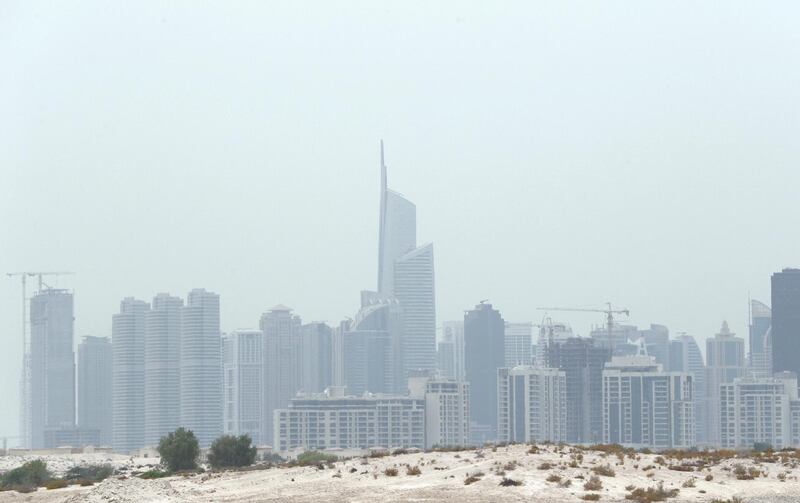 DUBAI , UNITED ARAB EMIRATES , JULY 28 – 2018 :- View of the residential and office towers in Jumeirah Lake Towers during the hazy weather in Dubai. ( Pawan Singh / The National )  For News.