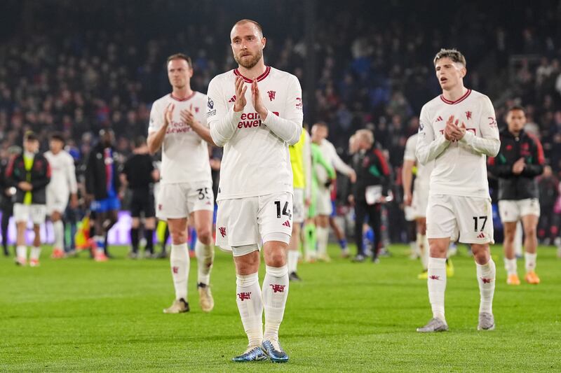 Christian Eriksen, Alejandro Garnacho, and Jonny Evans applaud the fans after Manchester United's 4-0 defeat to Crystal Palace at Selhurst Park in London on May 6, 2024. PA