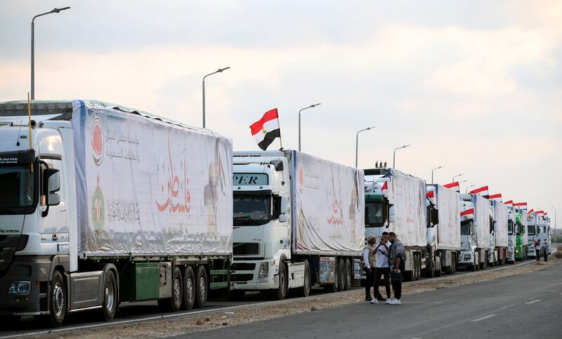 Lines of lorries carrying humanitarian aid wait to pass through the Rafah border crossing into Gaza. EPA