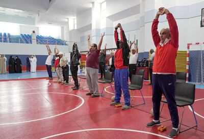 Abu Dhabi, United Arab Emirates, February 12, 2020.  
The launch of an “Active Seniors Program” by the Department of Community Development, at the Family Development Foundation, aspart of “Get Fit Abu Dhabi”.
--
 Senior fitness buffs do some stretching exercises at the at the Family Development Foundation Gym.
Victor Besa / The National
Section:  NA
Reporter:  Haneen Dajani